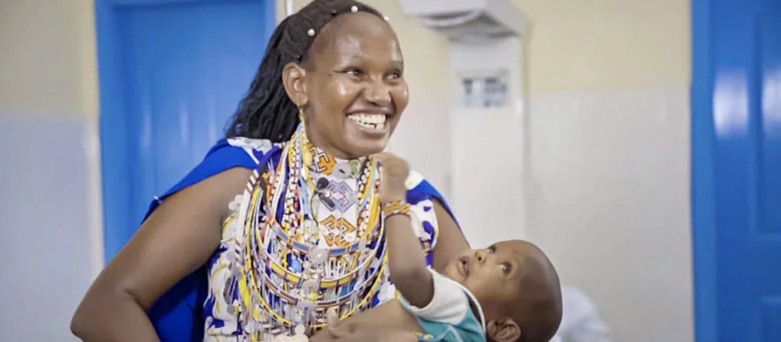 Woman from Africa holding her baby