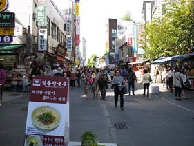 A streetscape in Korea shows bustling urban growth