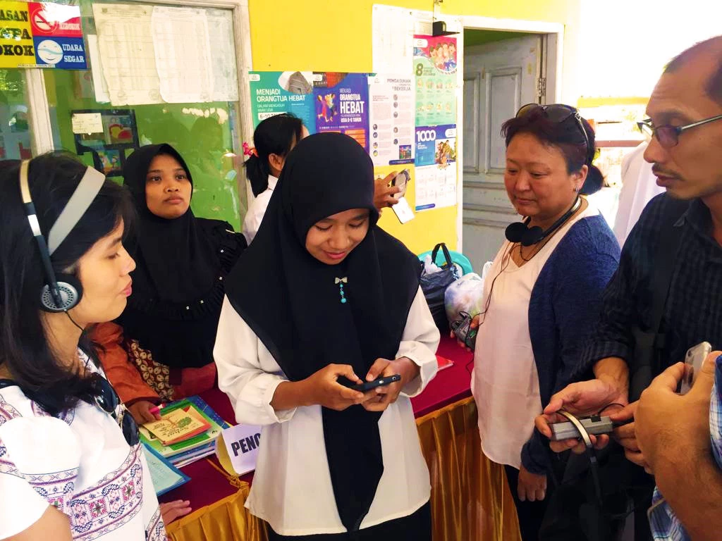 South Asian government officials listen to a nutritionist explaining how the e-posyandu application works in Lombok Barat District of Indonesia's West Nusa Tenggara Province.