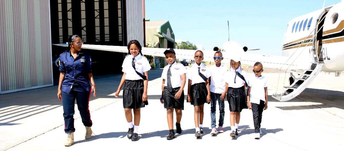 Captain Kgomotso Phatsima coming out of an introductory Inspirational Flight with students at Sir Seretse Khama International Airport, Gaborone, Botswana. Photo: Dare to Dream Foundation