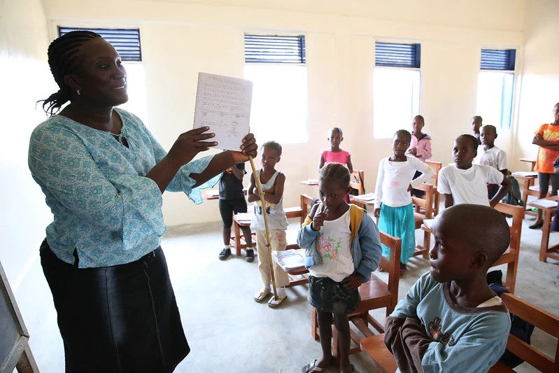 A teacher talks to her students during class at Billy Town Public School in Billy Town, Liberia after the threat of Ebola outbreak diminishes on March 5, 2015. (Photo: Dominic Chavez/World Bank)