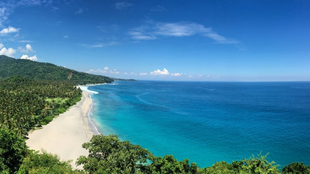 White beach and blue sea on Lombok Island where the World Bank is supporting a new LIPI Biodindustry center