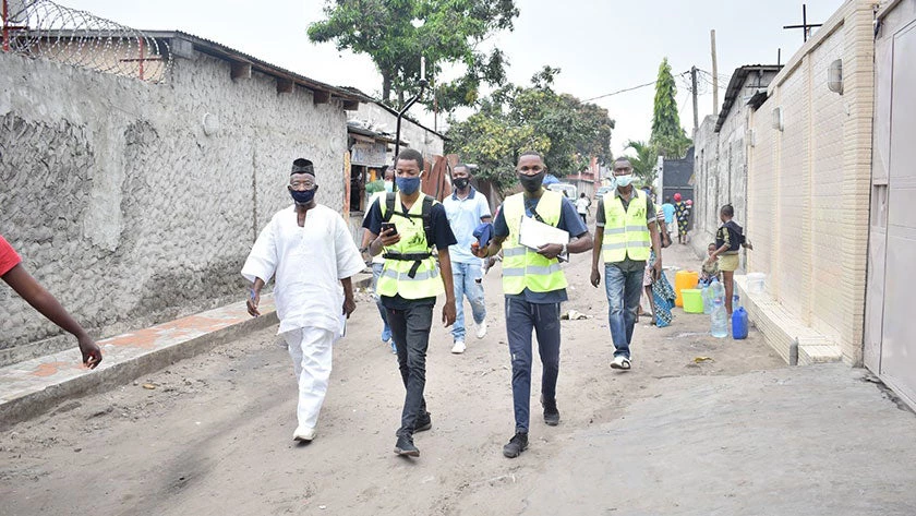 A team of young cartographers survey unmapped neighborhoods in Brazzaville, Congo, equipped with their cameras