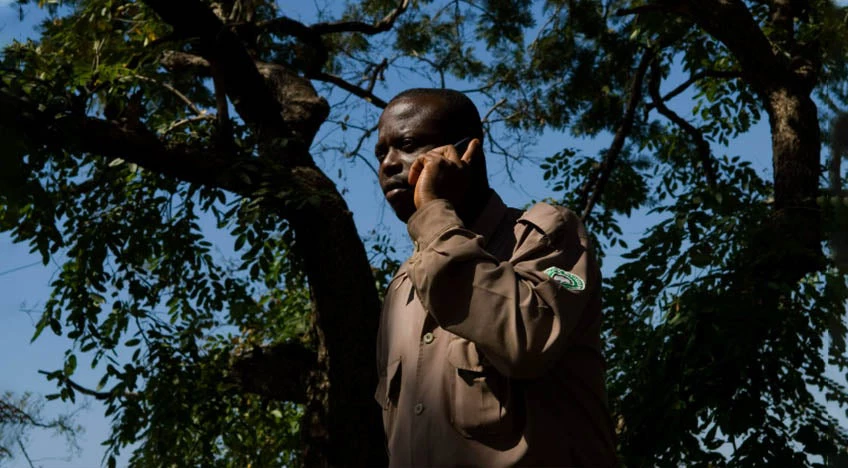 Man uses his cellphone to call.