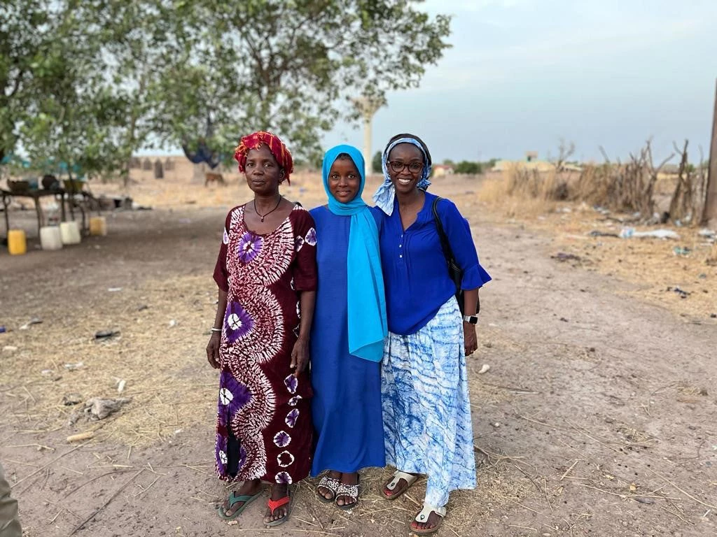 The author, Maty Dia, far right, Mariama, center, and Mariama?s mother, far left