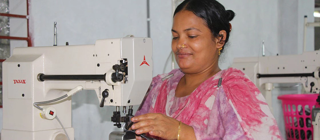 A well trained female worker using new technology to produce a shoe insole. Photo: People's Oriented Program Implementation