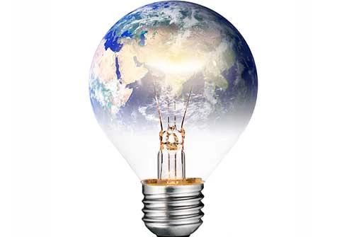 Switched ON Lightbulb in the Shape of the World - Shutterstock l tr3gin