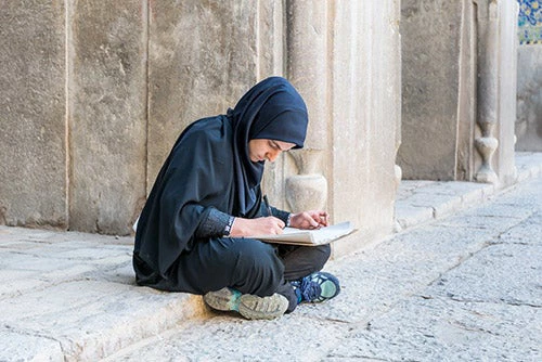 Victor Jiang | Shutterstock.com - A university student in Naqsh-e Jahan Square