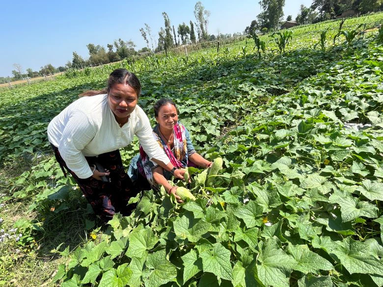 Meena Chaudhary with her friend in a vegetable farm. 