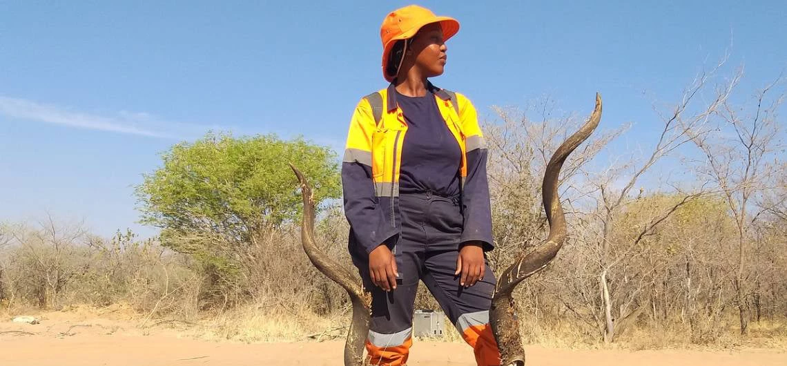 Matlhogonolo Mmese poses in front of an animal skull.