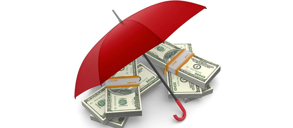 Stacks of banknotes under an umbrella | © shutterstock.com