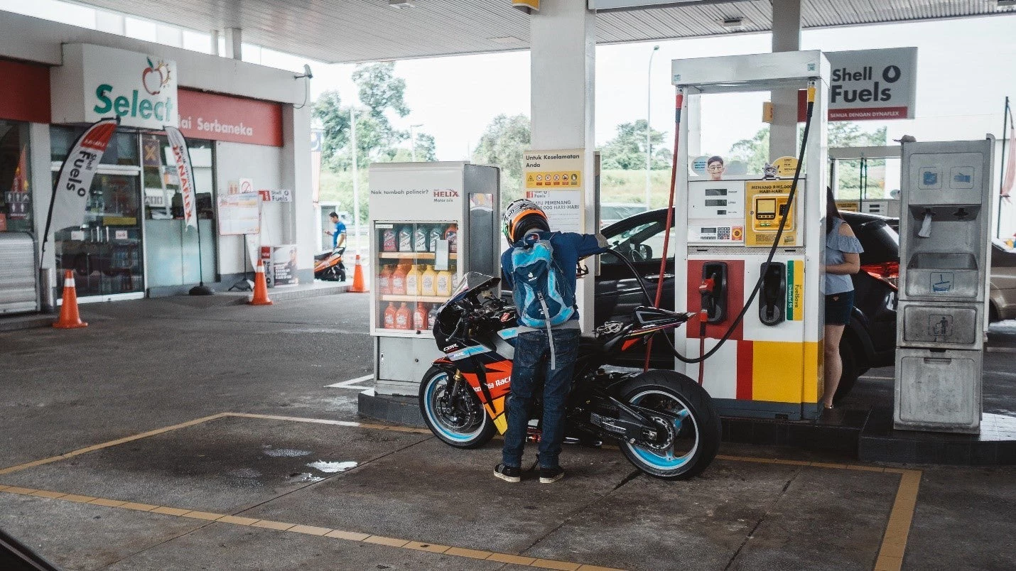 A motorcyclist fueling up petrol in Kuala Lumpur