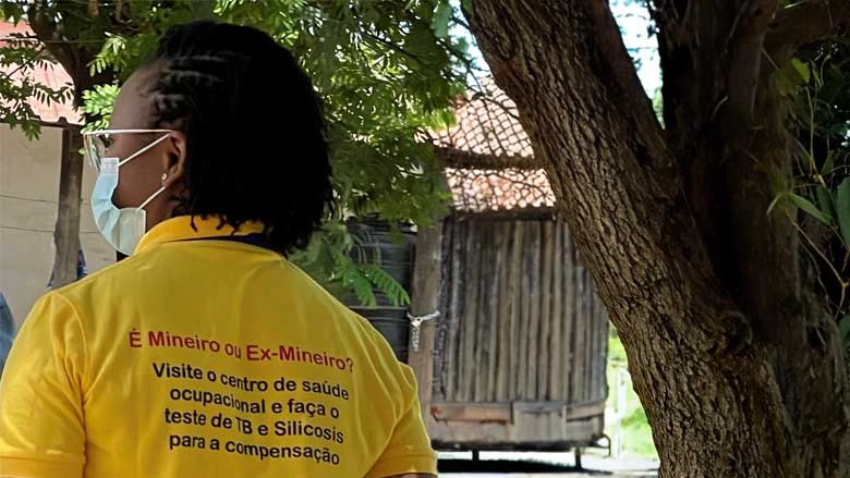 A worker encouraging miners to get their health screening done at Ressano Garcia, a town in Maputo Province, on the border with South Africa. Photo: Kavita Watsa