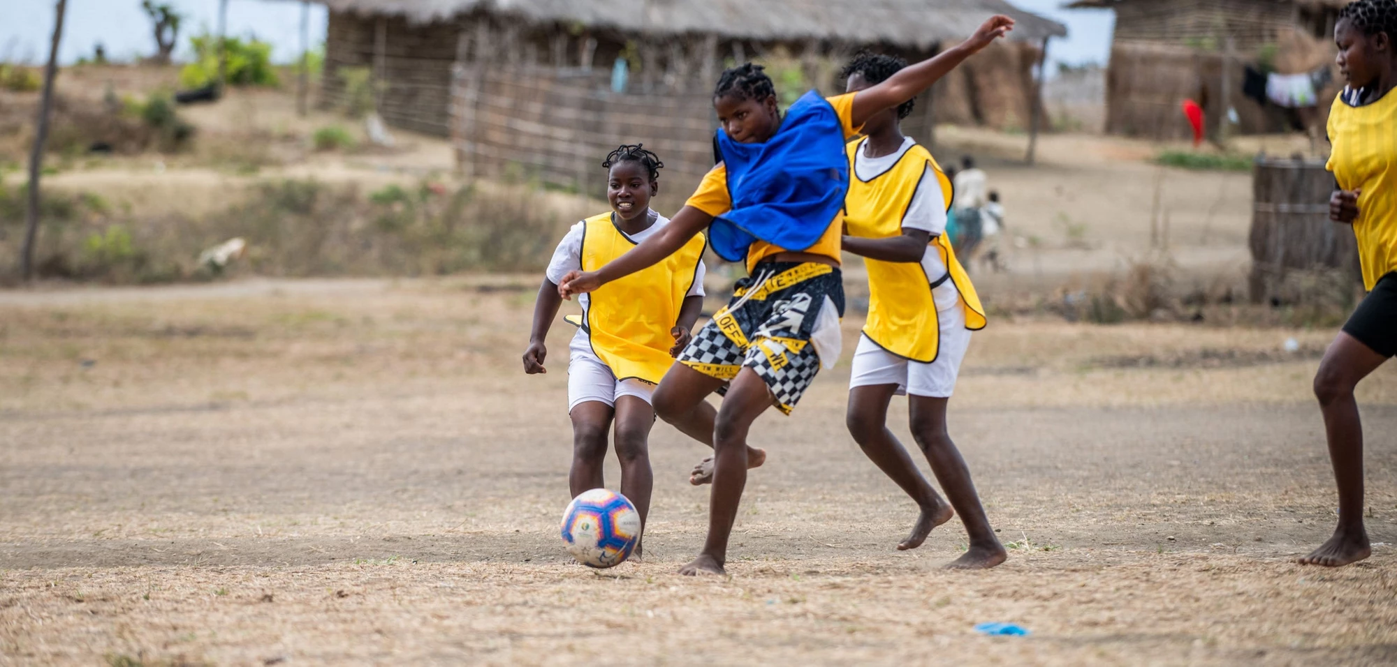 Young women playing soccer