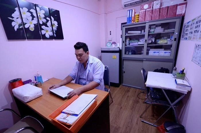 A caretaker at an HIV testing facility in Bangkok, Thailand.
