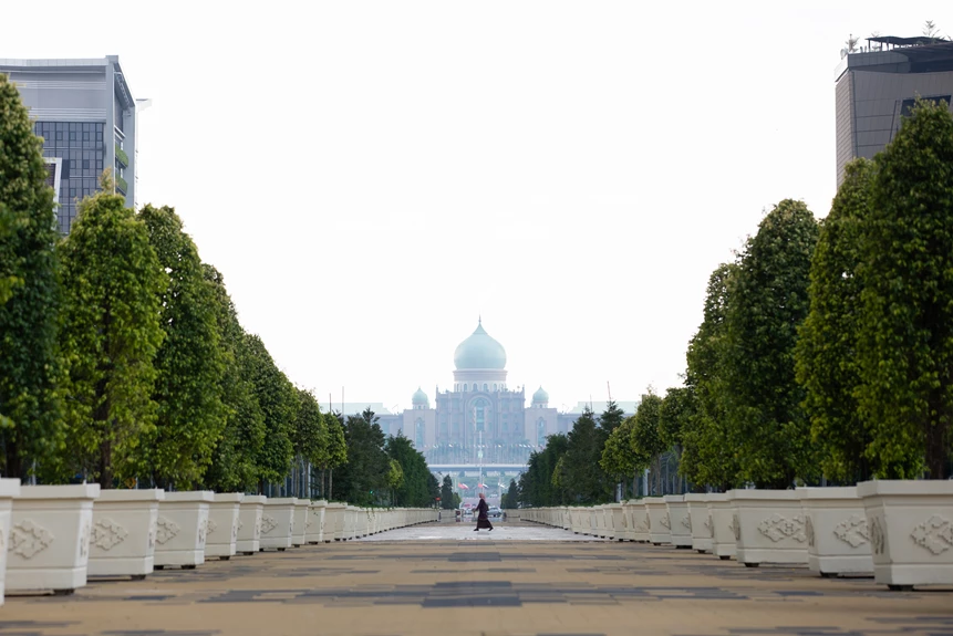A woman walks in Putrajaya, the federal administrative center of Malaysia. As the country gears up to work on its 12th Malaysia Plan, its rich experience in national development planning for the past 60 years provides key lessons to consider. 