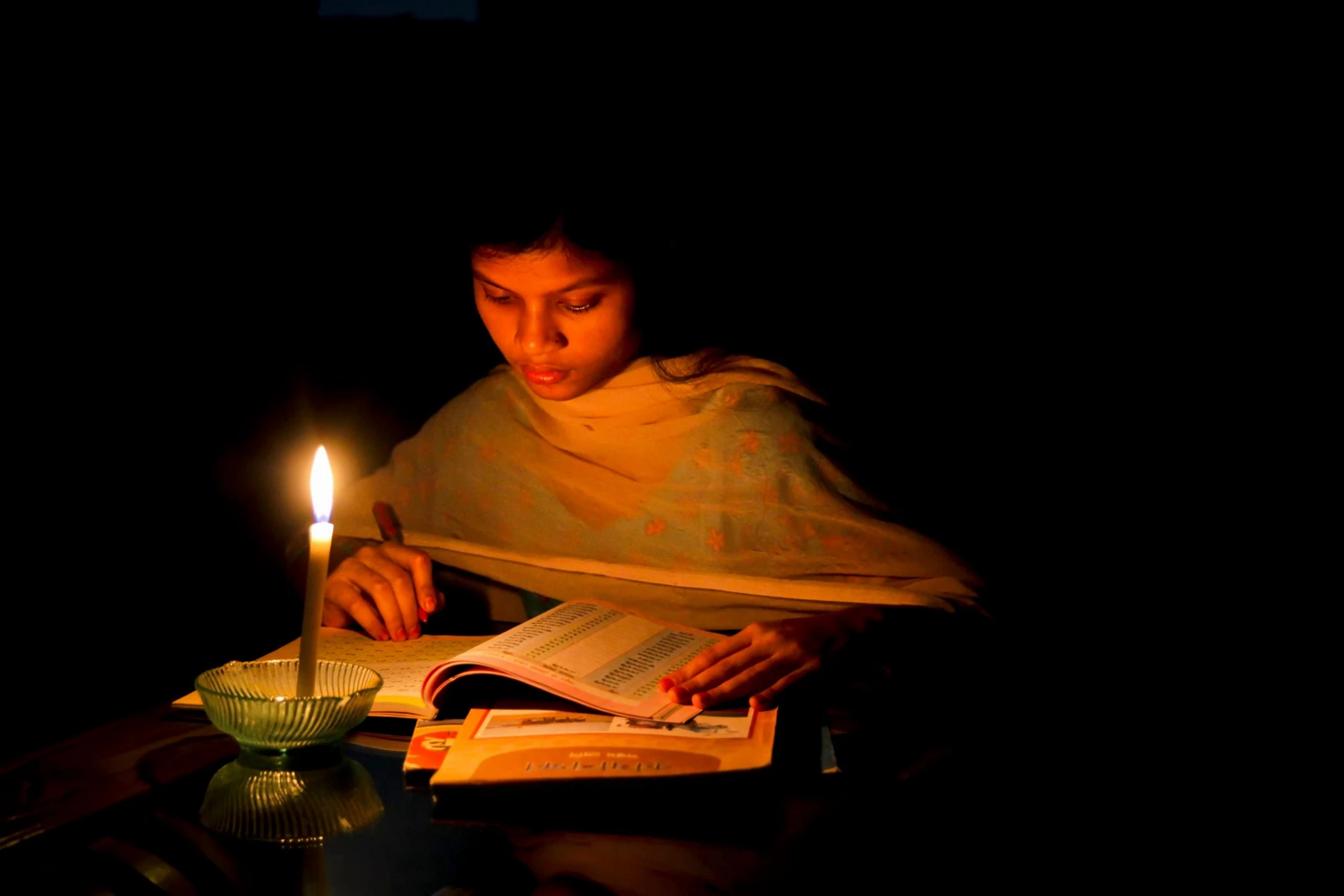 girl studying candle