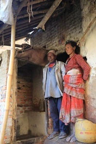 Chaturman and Nyuchemaya outside the new toilet on their back porch