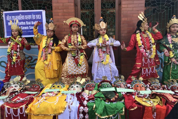 Nepalis putting on public cultural performances and earning a wage from it.