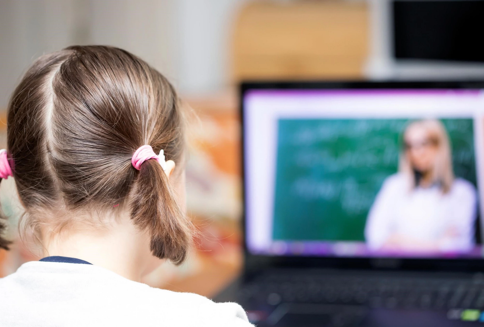 School girl watching online education classes and doing school homework. COVID-19 pandemic forces children online learning. Photo credit: Shutterstock