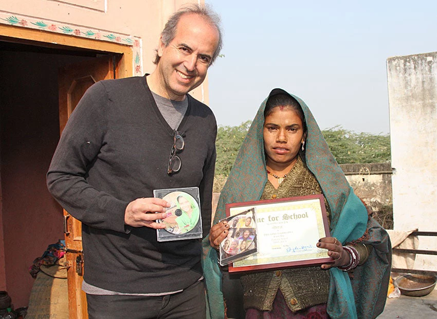 Oren with Neeraj holding her Time for School certificate 