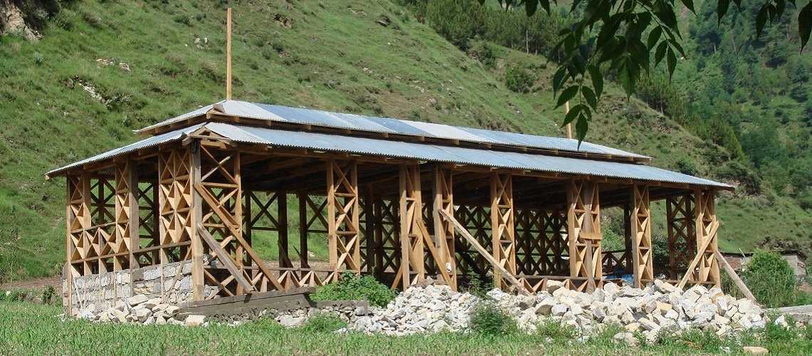 Home being rebuilt using a Dhaji timber structure in Pakistan