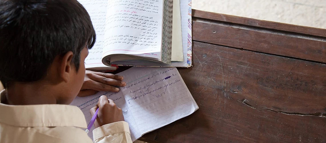 A boy studying in Sindh, Pakistan. Photo - razum / Shutterstock.com