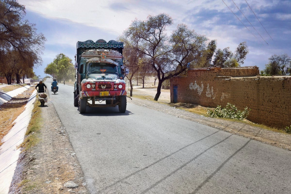 Truck traveling on commuting road in Peshawar, Pakistan