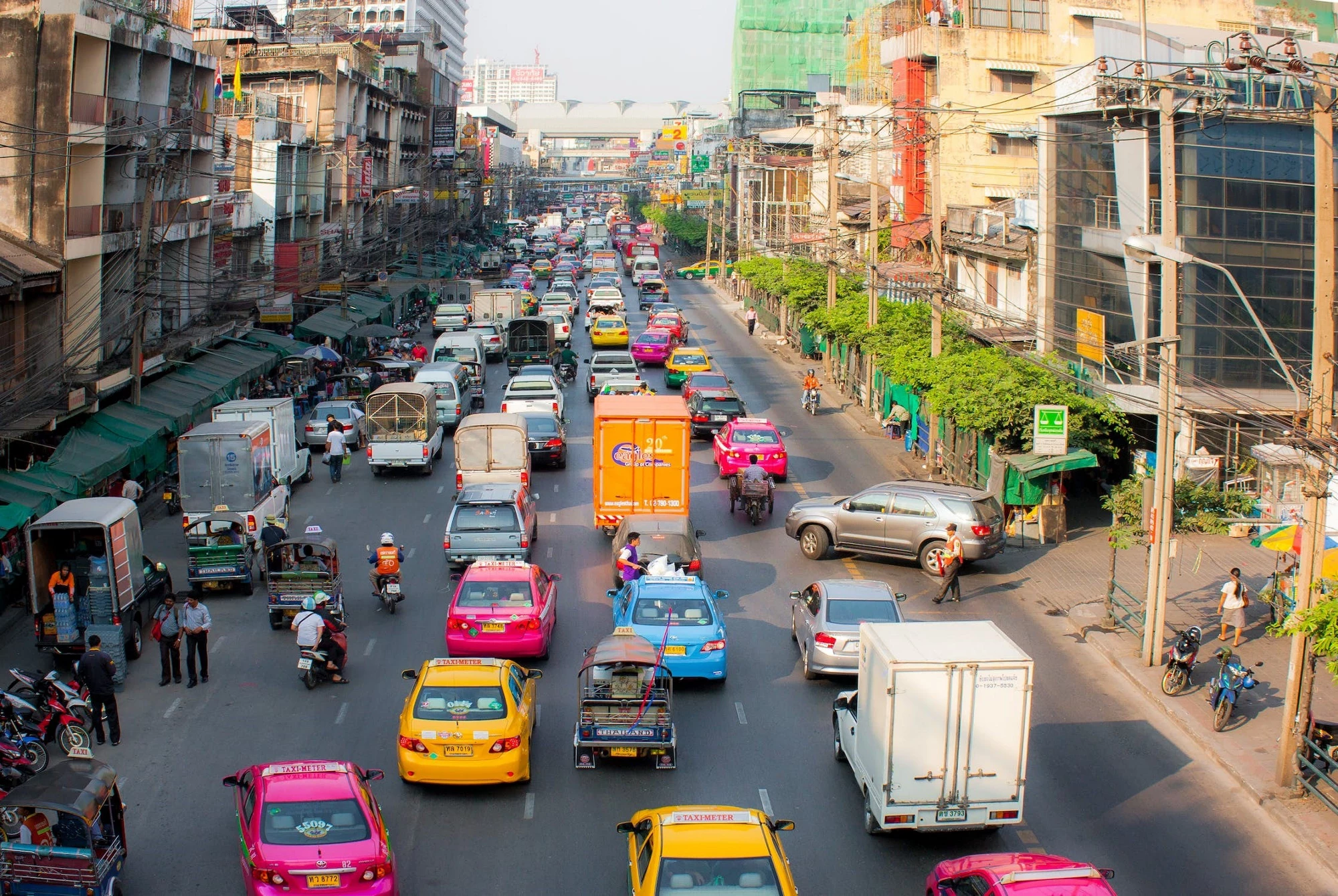 A busy road in Bangkok, Thailand with many types of road users.