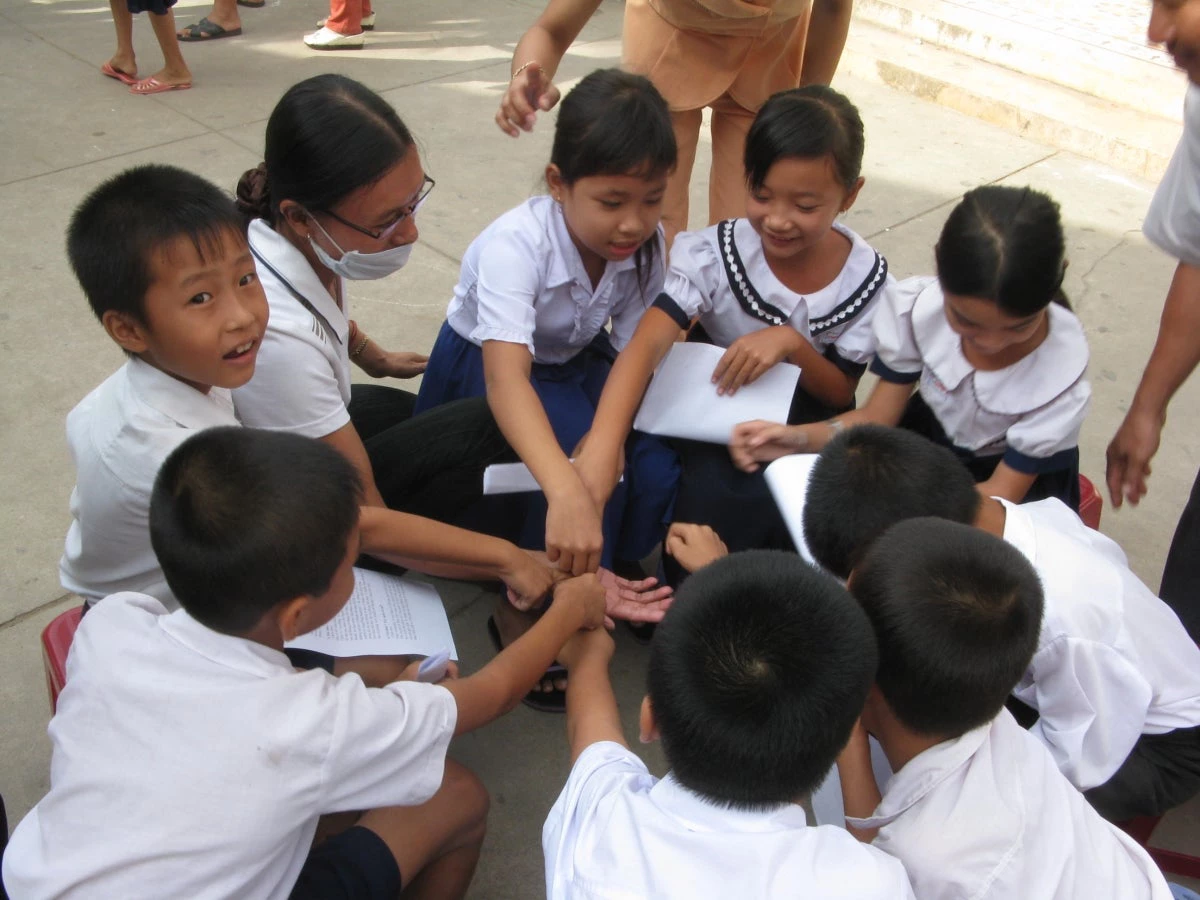 School children in Vietnam practice washing their hands with soap.