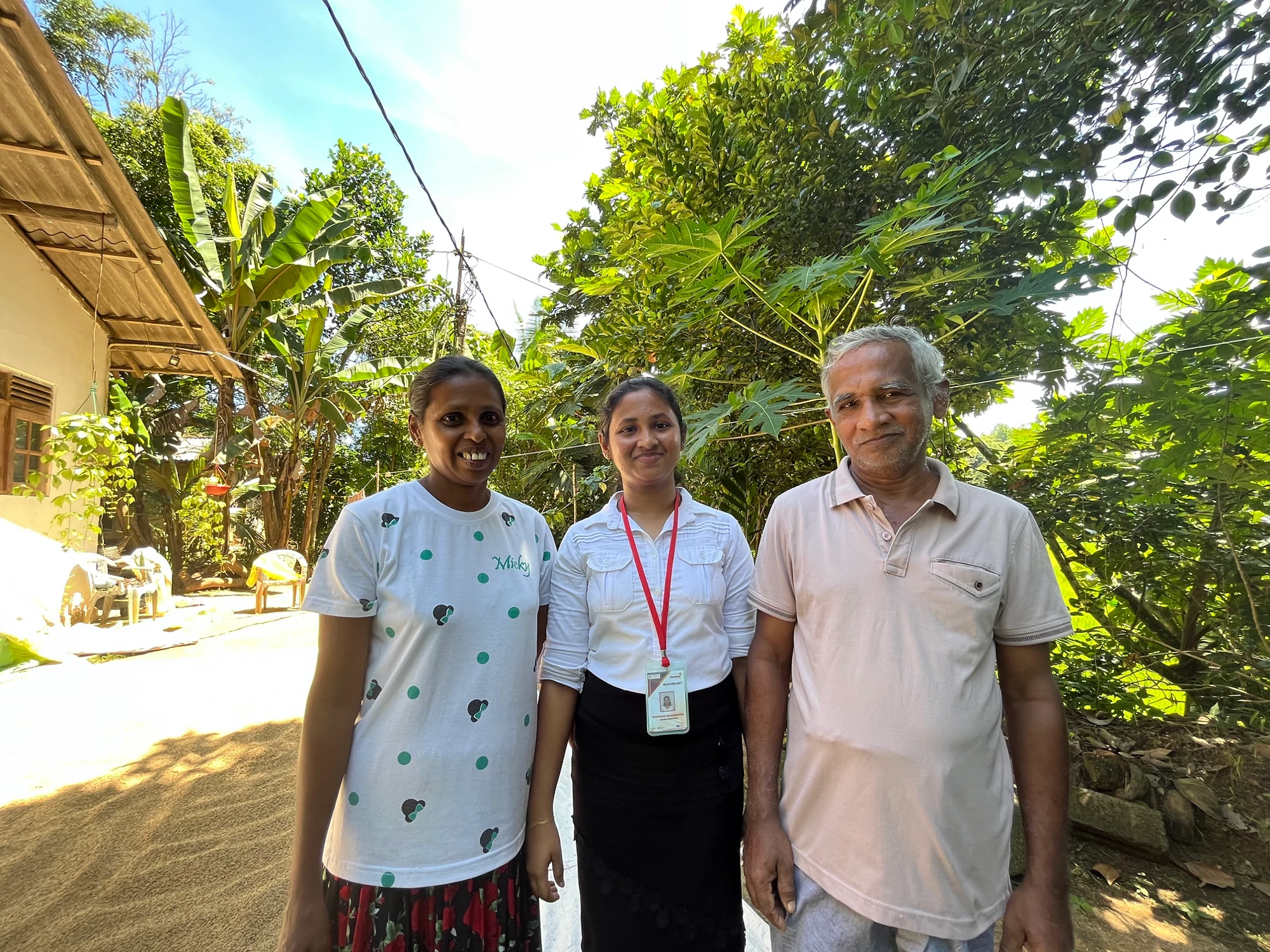 Poornima Madubashini, 23, with her parents. Photo: Savani Jayasooriya