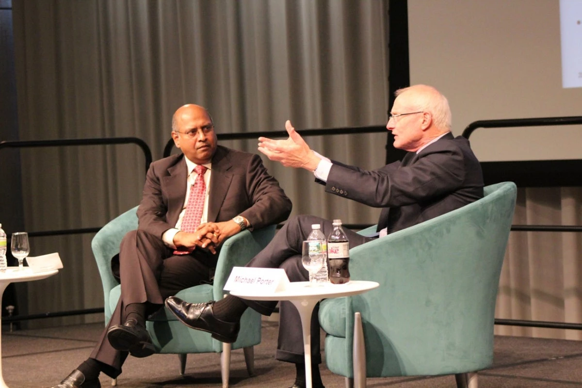 Michael Porter with World Bank Vice President Janamitra Devan. (Credit: Nazanine Atabaki)