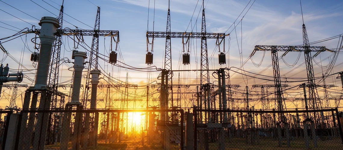 Power line pylons during sunset