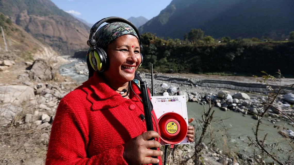 Sameera, a village resident, who shares weather information, early warnings, and public service announcements with neighboring villages via a low-cost, solar powered Rang Radio. Photo: WorldBank 