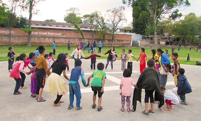 Kids at Uttar Dhoka participating in in Energizer before the start of the day's session. 