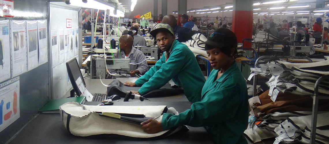 Workers as assembly line of an automotive factory for car seat covers for Ford, Volkswagen and BMW in an Industrial Estate in Maseru, Lesotho.