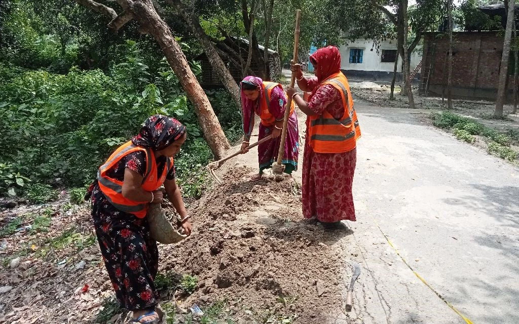 women building road