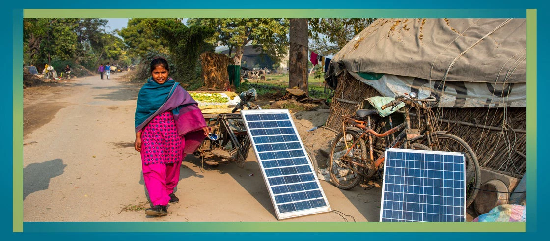 Picture of woman with solar panels in India. 
