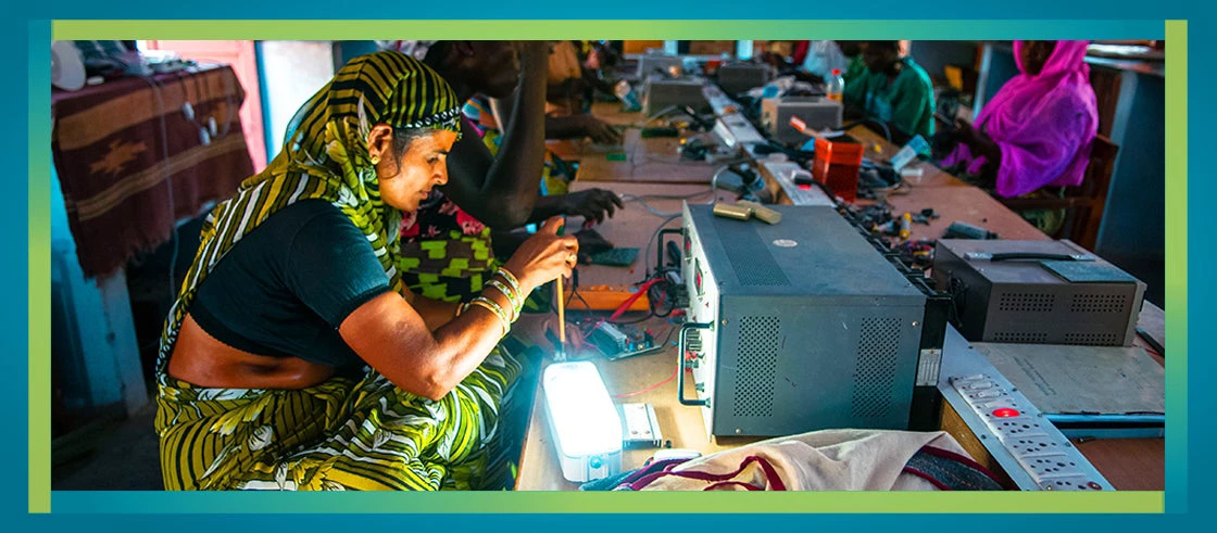 Picture of women learning to make solar lanterns in Rajasthan, India. 