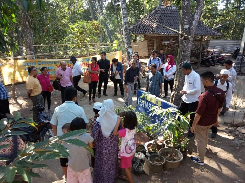 South Asian government officials observe a water installation in Lombok Barat District in Indonesia's West Nusa Tenggara Province.
