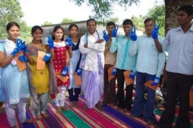 Village head with high school students receiving scholarship, Golamunda village in Orissa, 2010