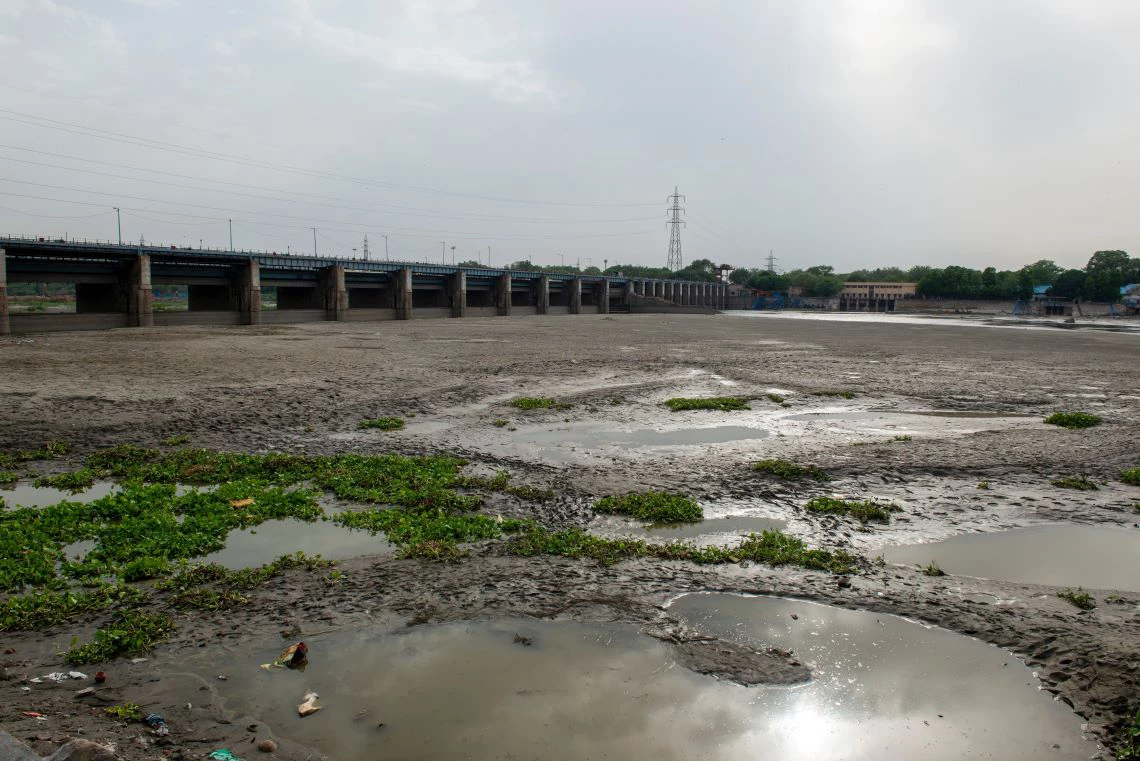 New Delhi, India-May 23 2022: A dried up empty reservoir or dam during a summer heatwave, low rainfall and drought type situation in delhi. climate change image