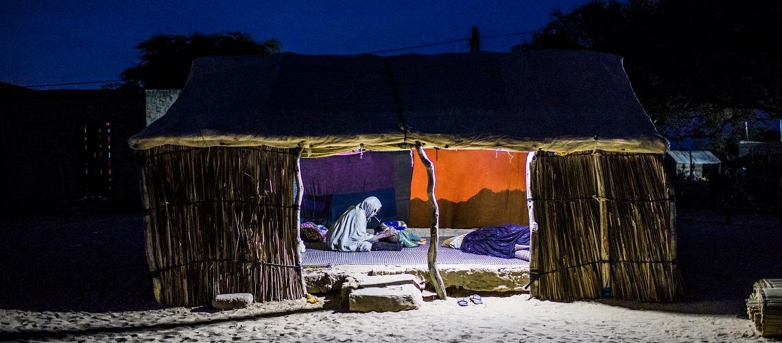 A woman puts to bed her baby at home, in Saint Louis, Senegal.