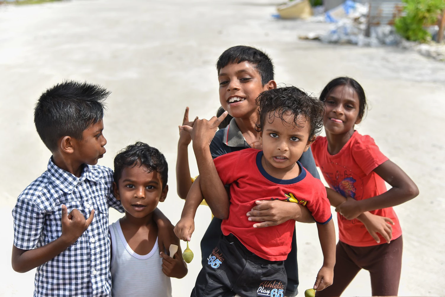 Children playing on the beach in Maafushi Island, Maldives