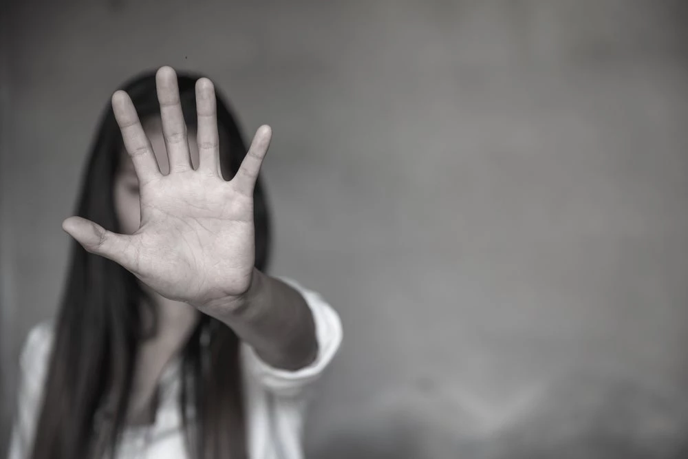 Photo of woman with hand over her face. (Shutterstock/ Tinnakorn Jorruang)