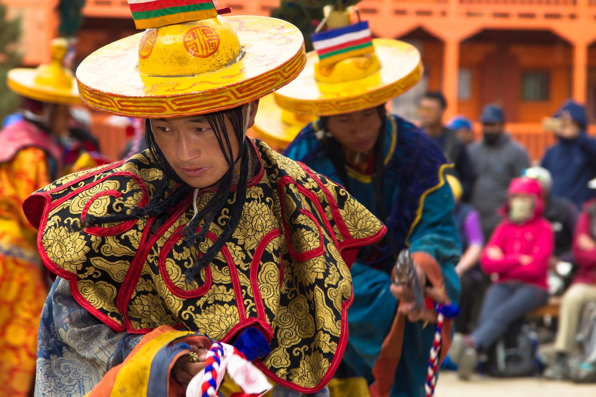 Monks perform a religious masked mystery dance of Tibetan Buddhism during the Tiji festival in monastery at Lo-Manthang, Nepal. Photo:Nowamhere / Shutterstock.com