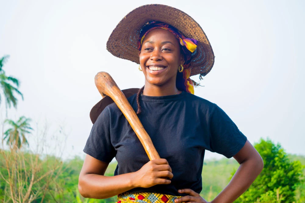 a young Nigerian woman feels happy working on farm