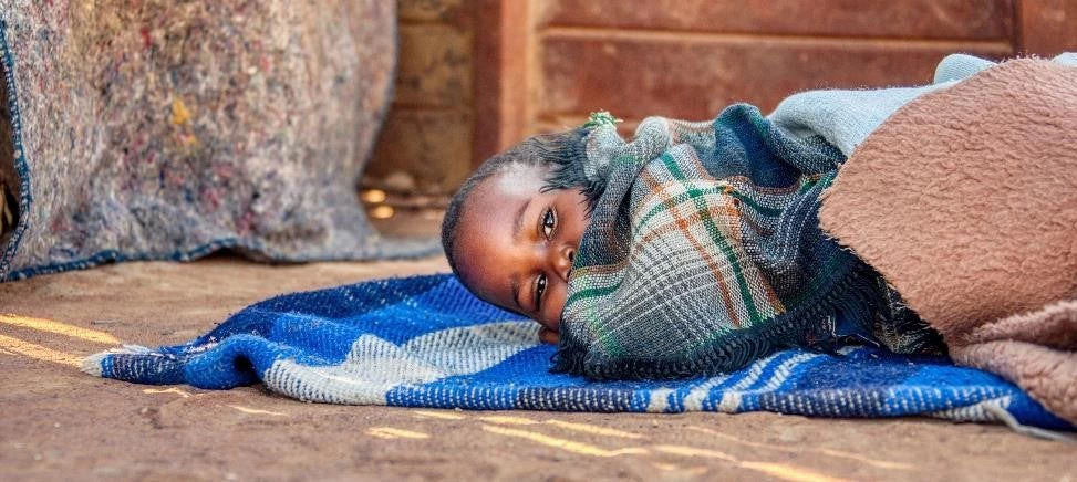 Sick child in a village in Botswana. Photo: Shutterstock