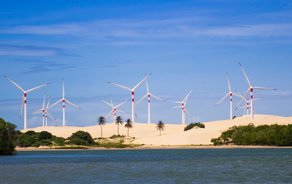 Wind energy turbines at the beach in Brazil © Jack R Looney Jr/Shutterstock