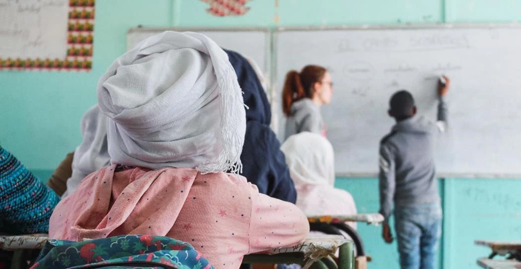 Girl attending class in a school in a refugee camp. Photo: Shutterstock